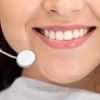 Close up of smiling woman attenting dental clinic